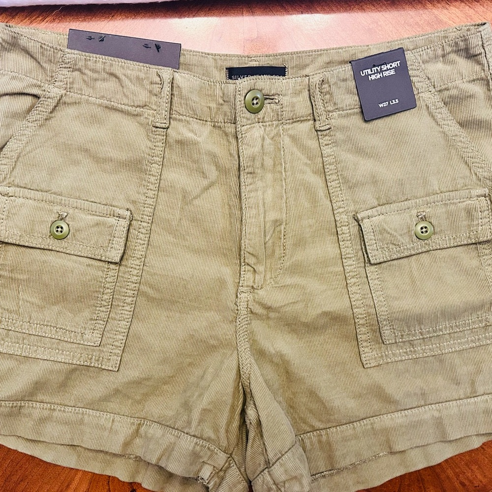 Silver high rise utility shorts.